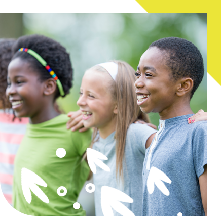 Three children in profile, playing outside with arms around each other