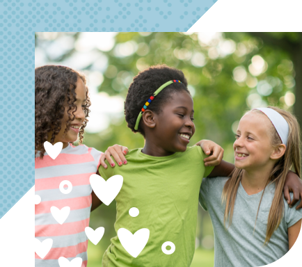 Three children outdoors, smiling  with arms around each other 