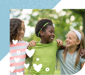 Three children outdoors, smiling  with arms around each other 